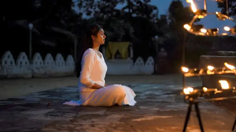 a woman practicing Ānāpānasati Meditation