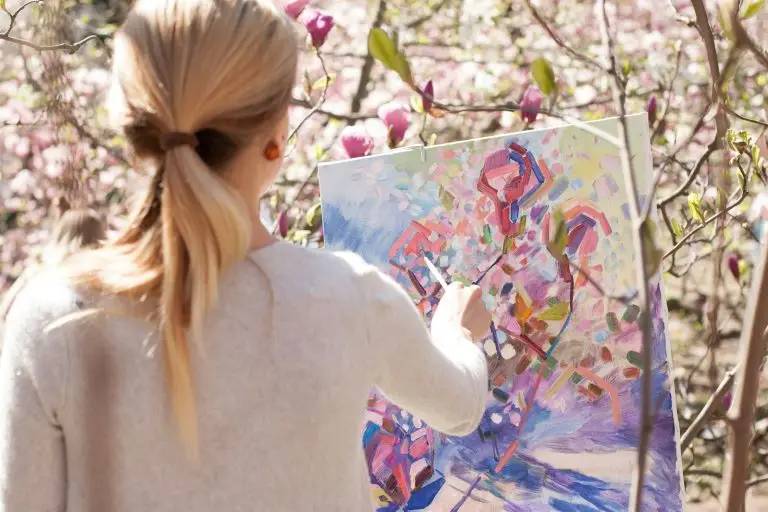 Woman exploring breathwork for creativity on her art