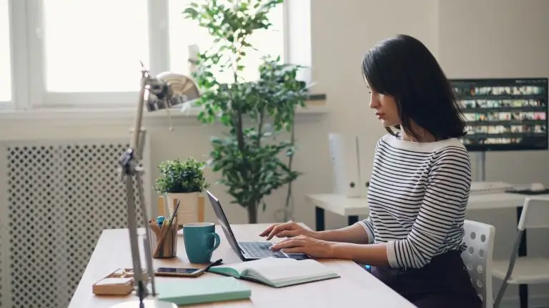 woman at desk learning how to Transform Your Life One Breath at a Time